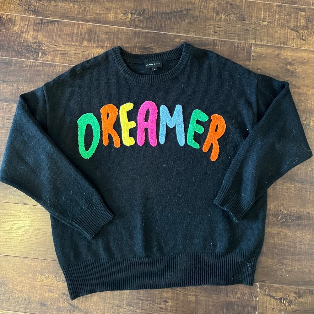 Black Crewneck Sweater with Rainbow Dreamer Design